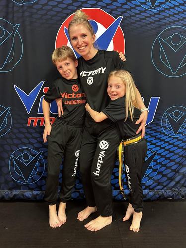 A mom with her son and daughter